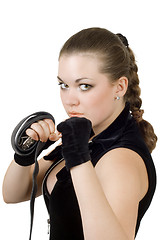 Image showing Pretty angry young woman throwing a punch. Isolated