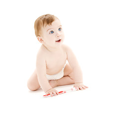 Image showing baby boy in diaper with toothbrush