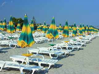 Image showing Beach with folded umbrellas