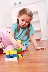 Image showing Adorable girl playing with blocks