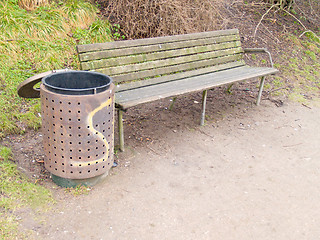 Image showing A peaceful bench and rubbish bin in a park