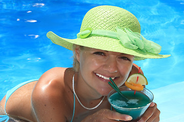 Image showing Woman in blue pool