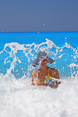 Image showing Pretty blonde woman enjoying the Ionian sea in Greece