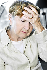 Image showing Elderly woman holding head