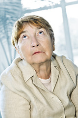 Image showing Elderly woman looking up