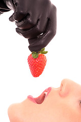 Image showing Beautiful girl holding strawberry 