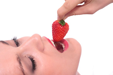 Image showing Beautiful girl holding strawberry 