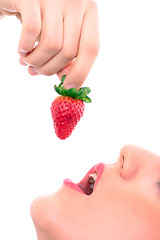 Image showing Beautiful girl holding strawberry 