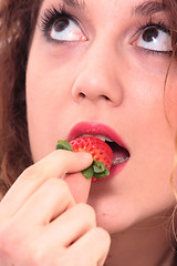 Image showing Beautiful girl holding strawberry 