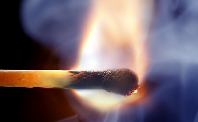 Image showing A burning Match