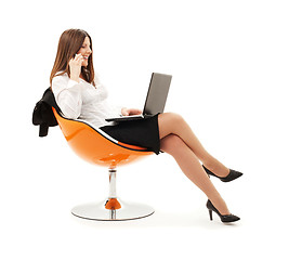 Image showing businesswoman in chair with laptop and phone