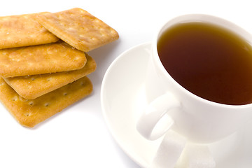 Image showing cup of tea, sugar and cookies