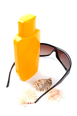 Image showing sunglasses and lotion