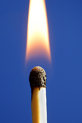 Image showing A burning Match