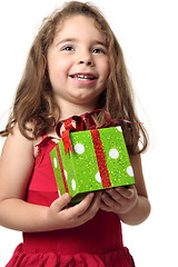 Image showing Excited girl holding a present
