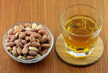 Image showing Whisky with peanuts