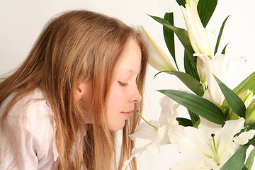 Image showing Girl and lilies