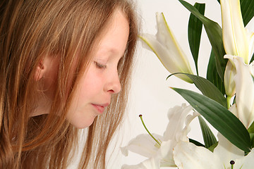 Image showing Girl and lilies