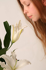 Image showing Girl and lilies