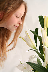 Image showing Girl and lilies