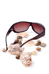 Image showing sunglasses, shells and pebbles