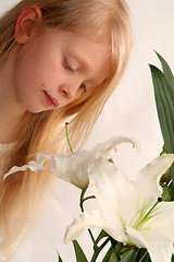 Image showing Girl and lilies