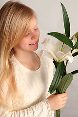 Image showing Girl and lilies