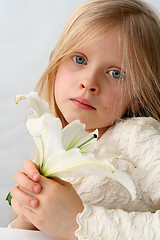 Image showing Girl and lilies