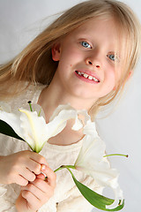 Image showing Girl and lilies