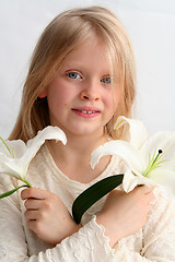 Image showing Girl and lilies