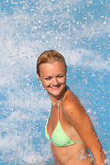 Image showing Young beautiful happy smiling tanned blond woman in bikini