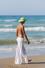 Image showing Beautiful young woman relaxing near the sea