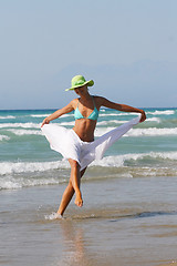 Image showing Beautiful young woman relaxing near the sea