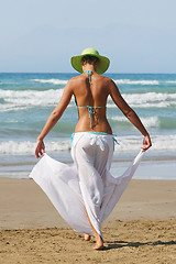 Image showing woman standing on shoreline at the beach in Greece