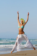 Image showing woman standing on shoreline at the beach in Greece