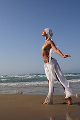 Image showing woman standing on shoreline at the beach in Greece