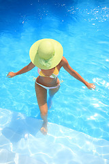 Image showing Young woman in a swimming pool
