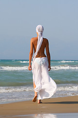 Image showing Beautiful young woman relaxing near the sea