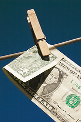 Image showing dollar bill folded on the line