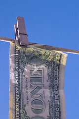 Image showing dollar bill on the line