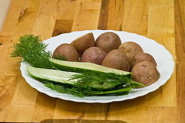 Image showing Potatoes, salt cucumber and dill still-life