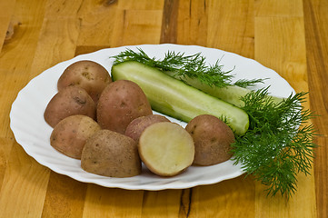 Image showing Potatoes, salt cucumber and dill still-life