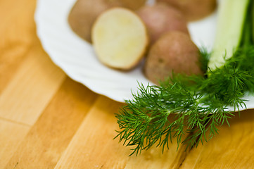 Image showing Potatoes, salt cucumber and dill still-life