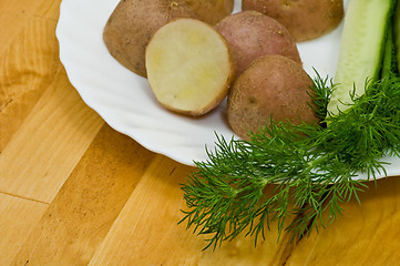 Image showing Potatoes, salt cucumber and dill still-life