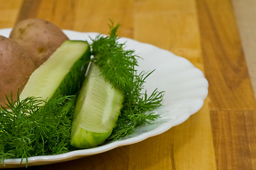 Image showing Potatoes, salt cucumber and dill still-life