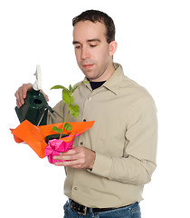 Image showing Man Watering Plant