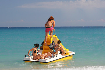 Image showing Group of people on a pedalo