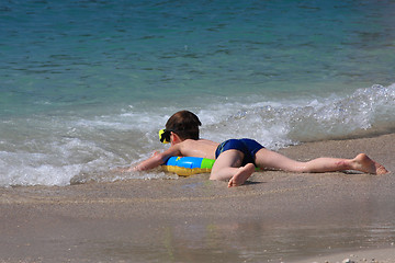 Image showing Young boy in the sea