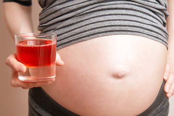 Image showing pregnant woman with a juice