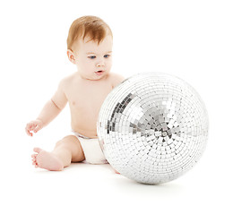 Image showing adorable baby boy with big disco ball